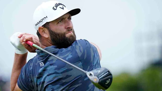 Jon Rahm tees off on the 16th hole during the third day of the 2023 British Open at Royal Liverpool Golf Club.
